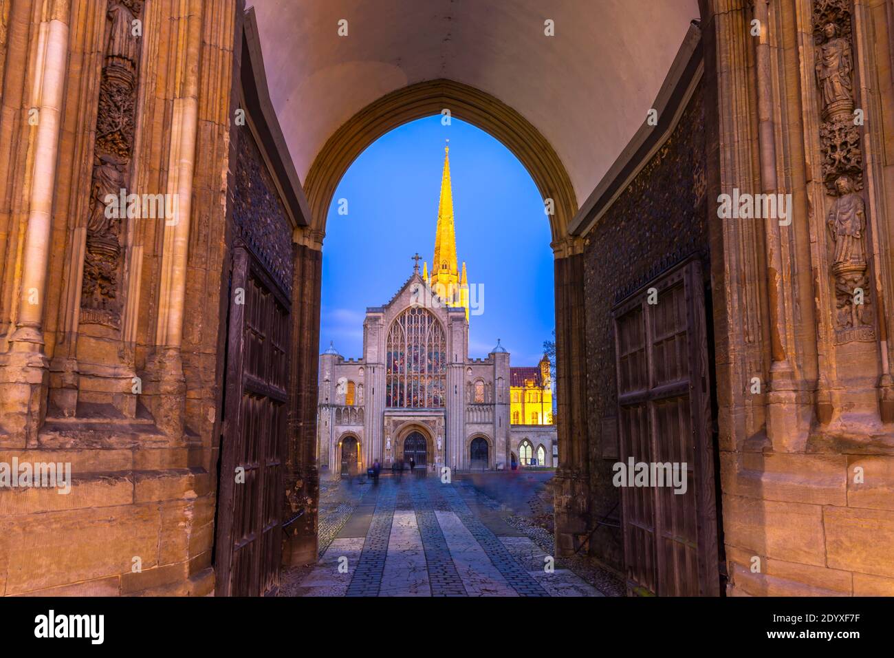 Norwich Cathedral viewed through arch at dusk, Norwich, Norfolk, East Anglia, England, United Kingdom, Europe Stock Photo