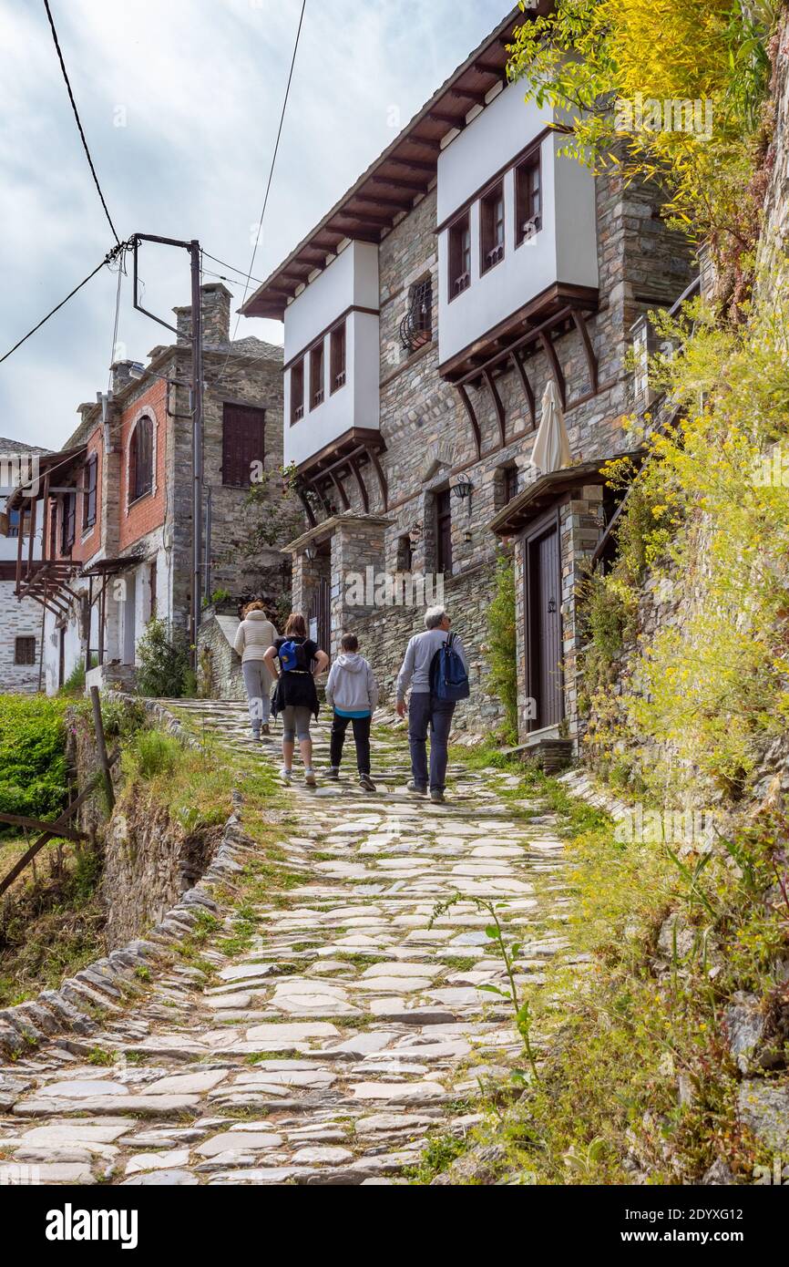 Makrinitsa, Greece - May 03, 2019: Tourists walking in the street in Makrinitsa village of Pelion, Greece Stock Photo