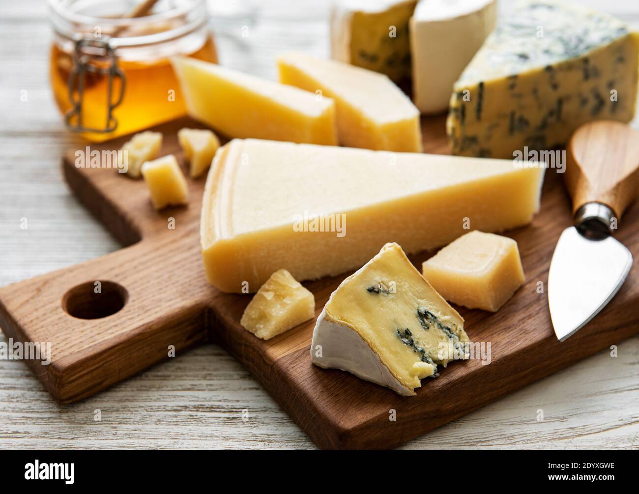 Various types of cheese on a white wooden background Stock Photo - Alamy