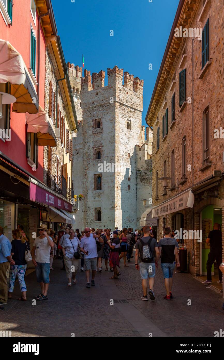 View of Castello di Sirmione and busy street on a sunny day, Sirmione, Lake Garda, Province of Verona, Italy, Europe Stock Photo