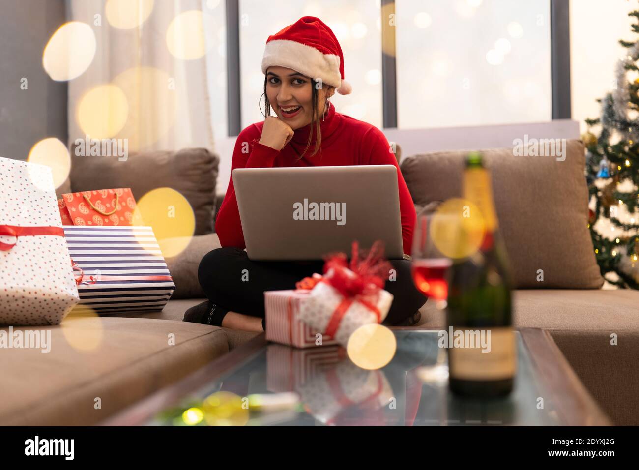 Happy Woman Making Video Call During Christmas Celebration Stock Photo