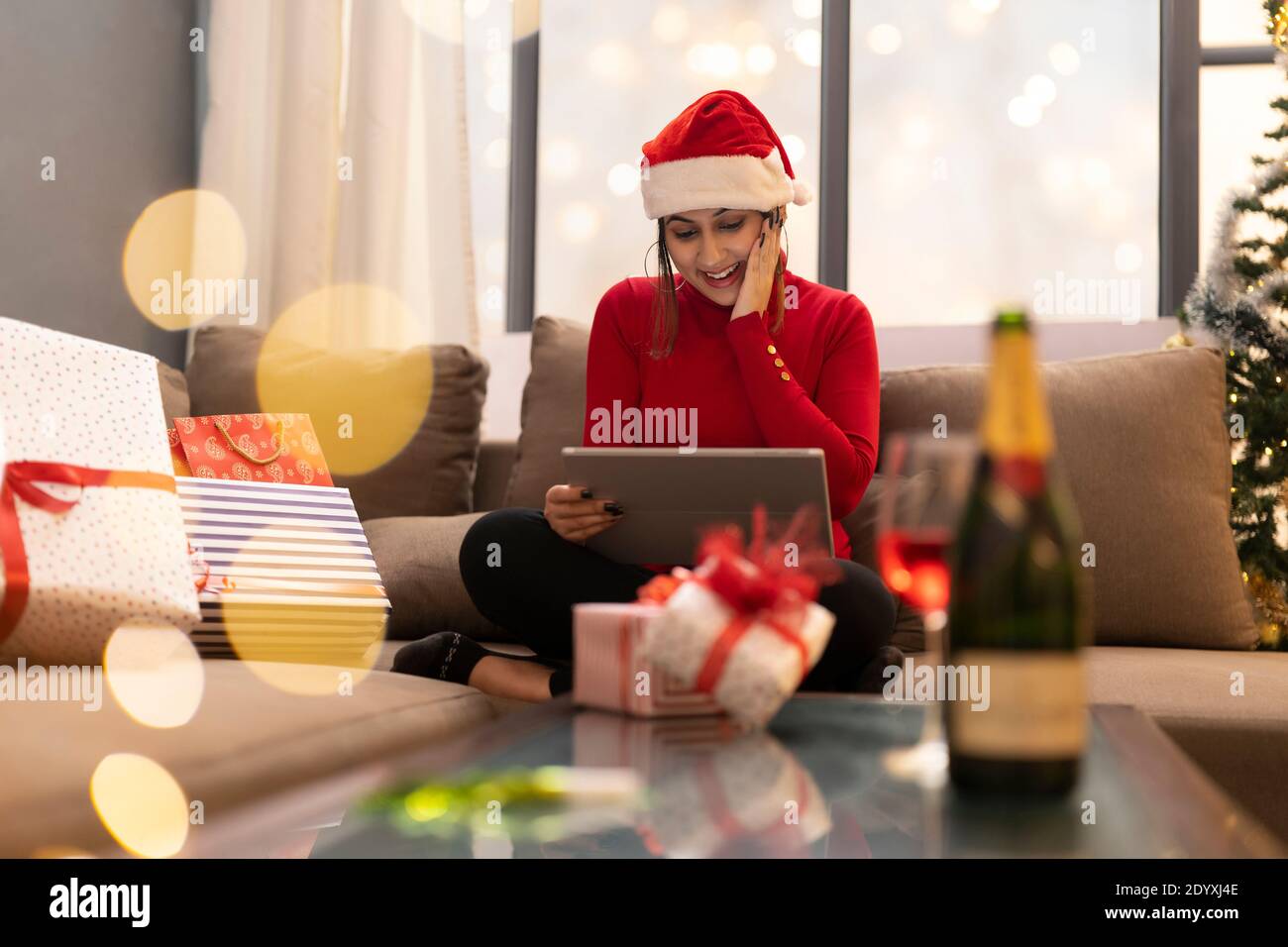 Happy Woman Making Video Call During Christmas Celebration Stock Photo