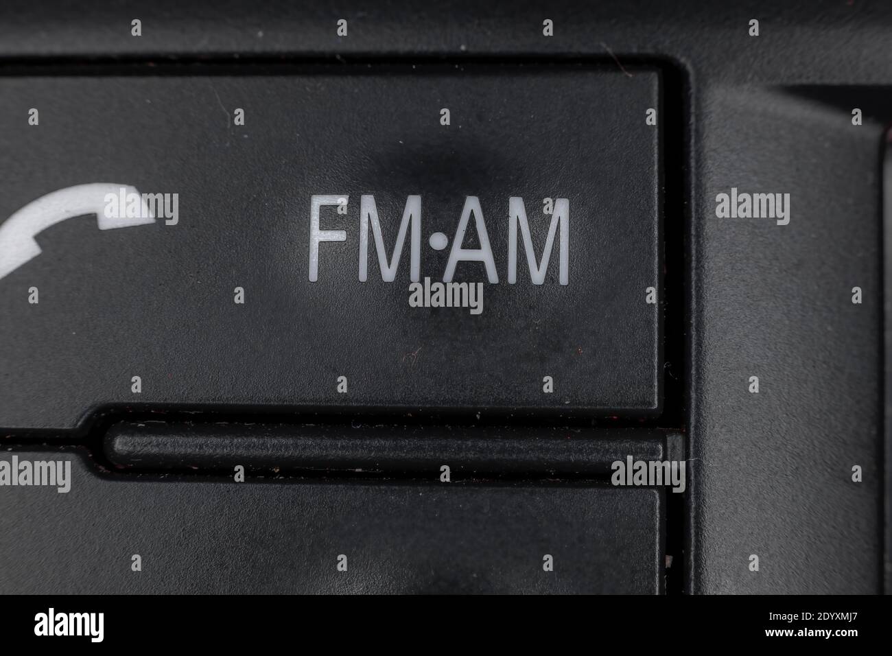 Am fm radio button on a car dashboard Stock Photo Alamy