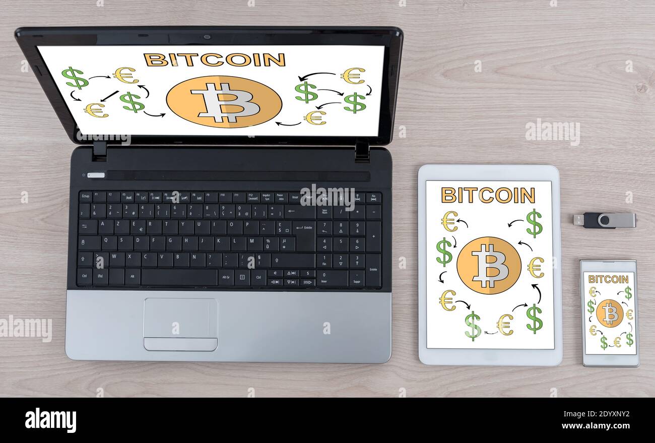 Bitcoin concept shown on different information technology devices Stock Photo