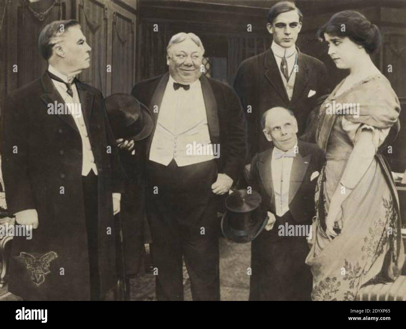 Scene still from the 1912 Vitagraph production Chumps. Left to right: William Shea, John Bunny, Wallace Reid, Marshall P. Wilder, and Leah Baird. Stock Photo