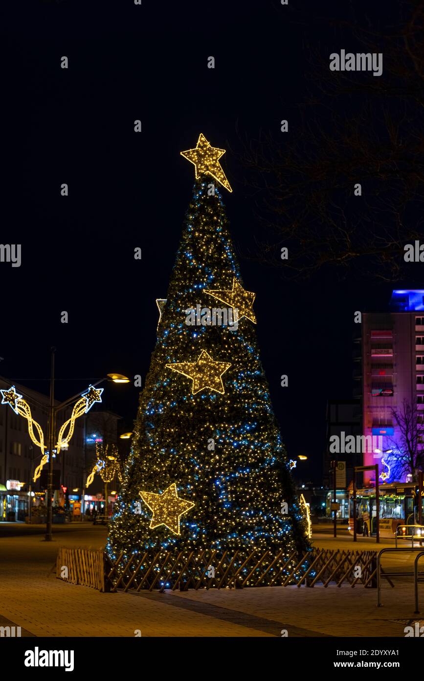 Christmas tree is erected in Germany to bring joy to people on holiday season. Stock Photo