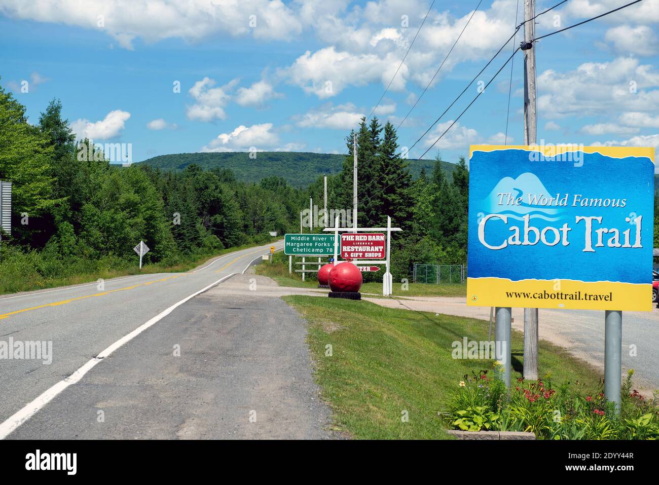 Baddeck, Canada - August 8, 2016:  Sign for world famous Cabot Trail in Cape Breton, Nova Scotia shows two different options of travelling around the Stock Photo