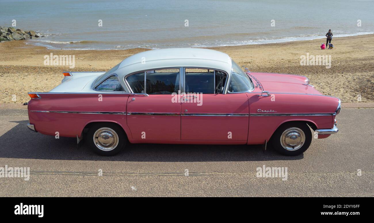 Classic Pink & White Vauxhall  Cresta parked on seafront promenade. Stock Photo