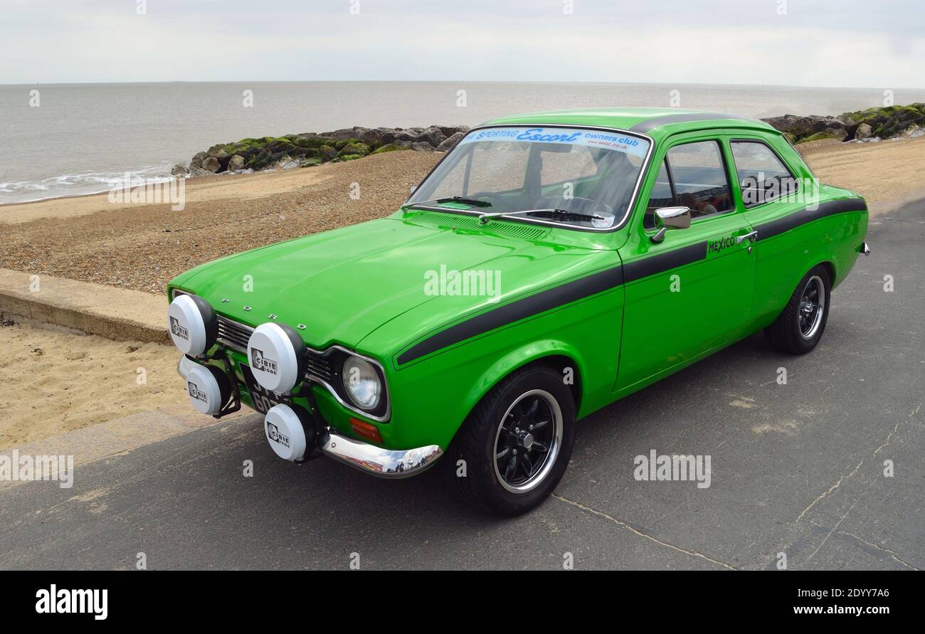 Classic Green Ford Escort Mexico  Motor Car Parked on seafront promenade. Stock Photo