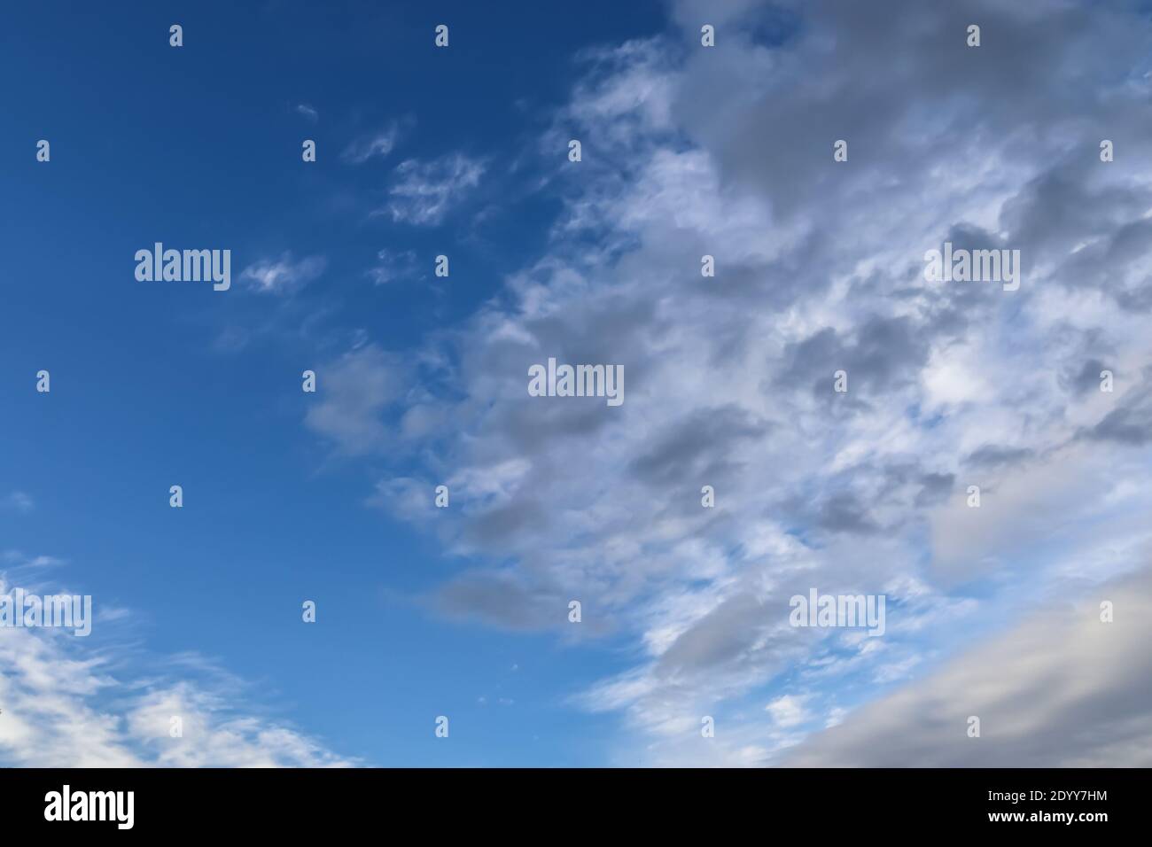 Stunning cirrus cloud formation panorama in a deep blue summer sky seen ...