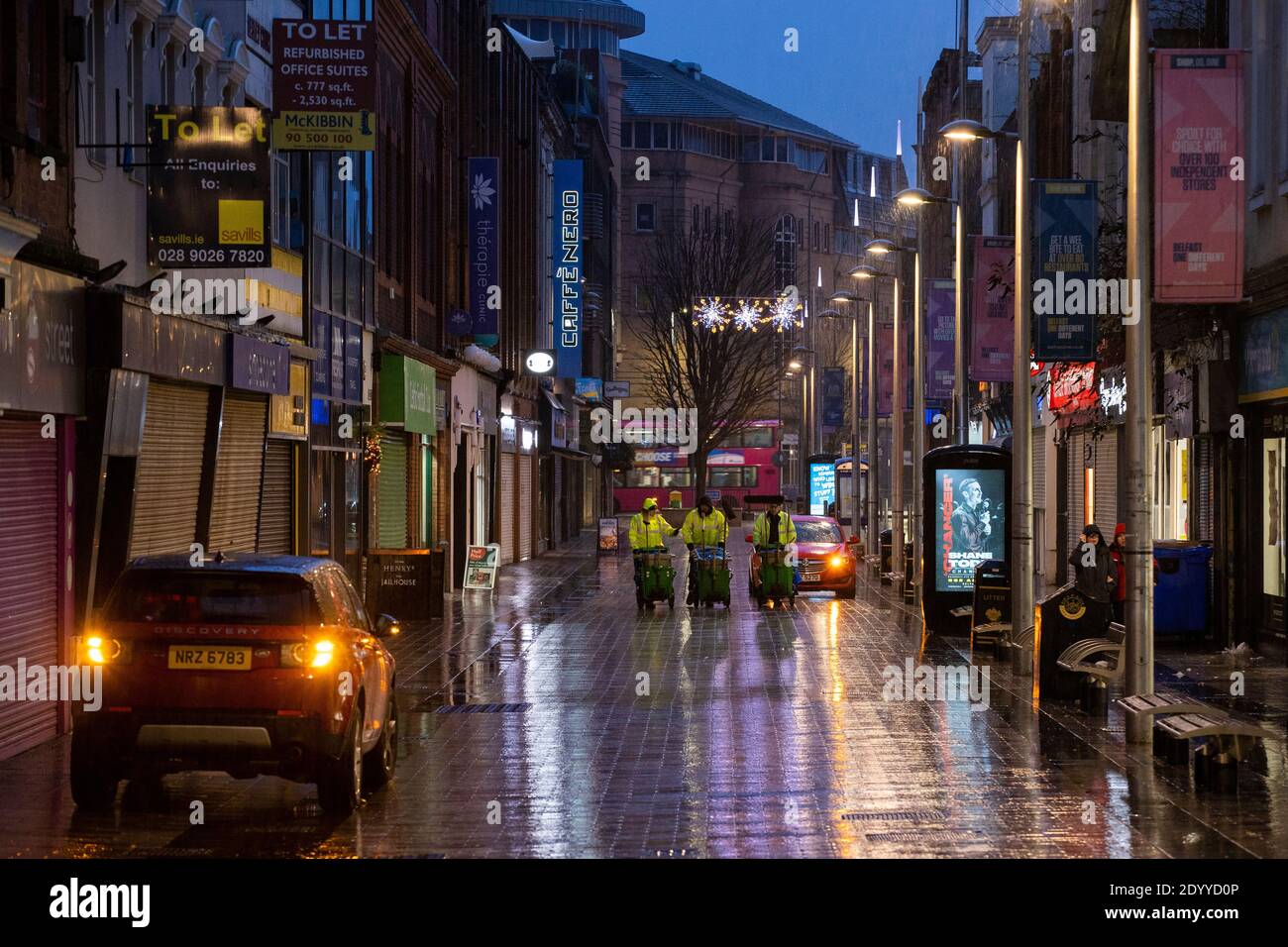 Street cleaners on Ann Street in Belfast on the third day of a six week