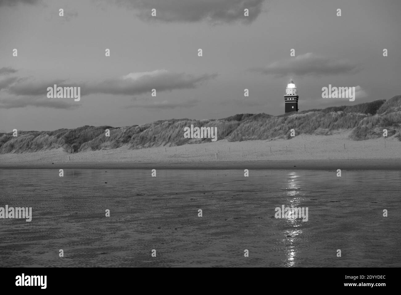 Black and whiteLighthouse standing on the Dutch coast with a dramatic ...