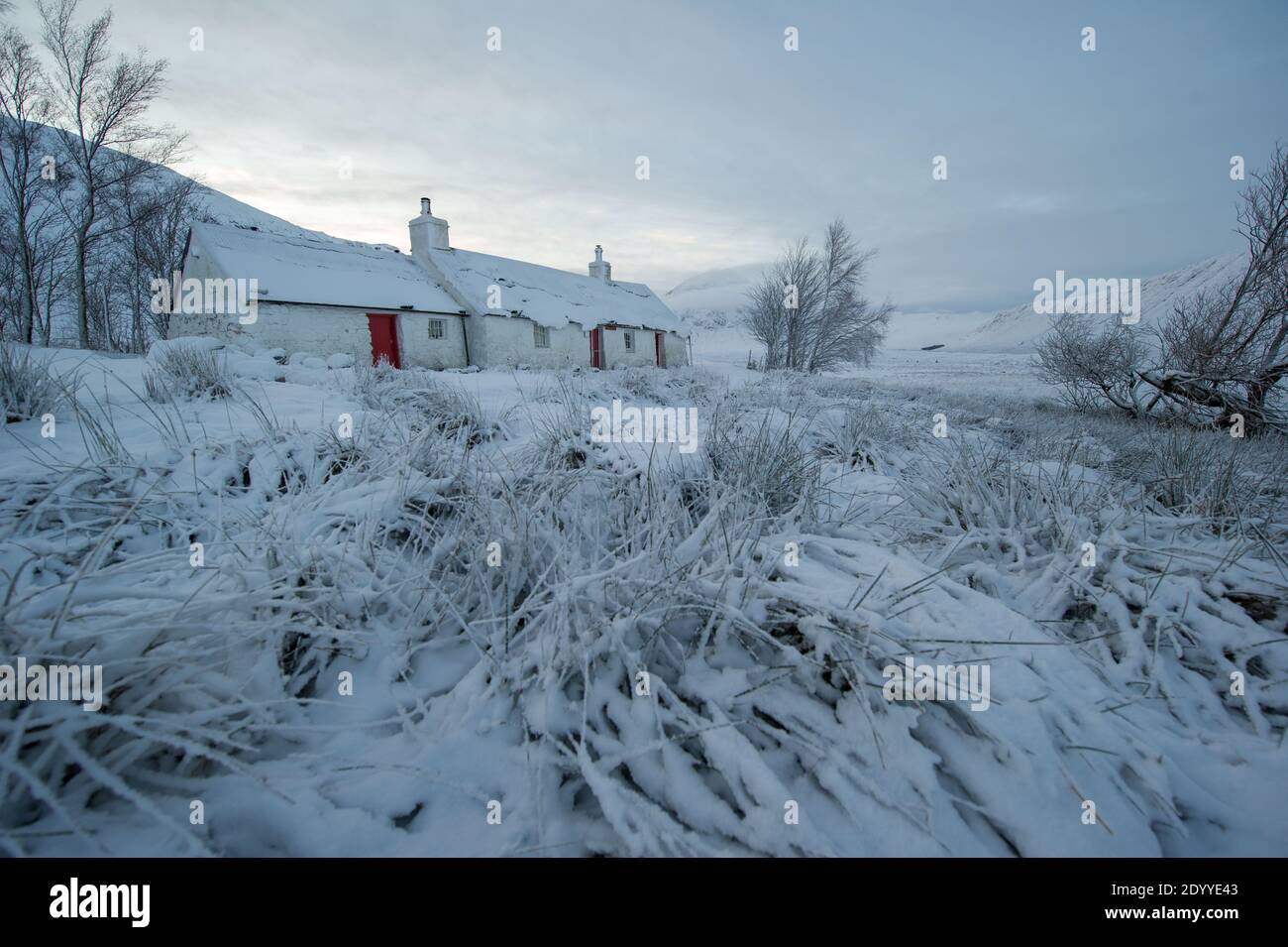 Glencoe, Scotland, UK. 28th Dec, 2020. Pictured: Glencoe under a carpet of snow. Snow still lying on the hills from overnight snow fall from Storm Bella. Freezing temperatures with a Yellow Warning still in place issued by the MET Office. Credit: Colin Fisher/Alamy Live News Stock Photo