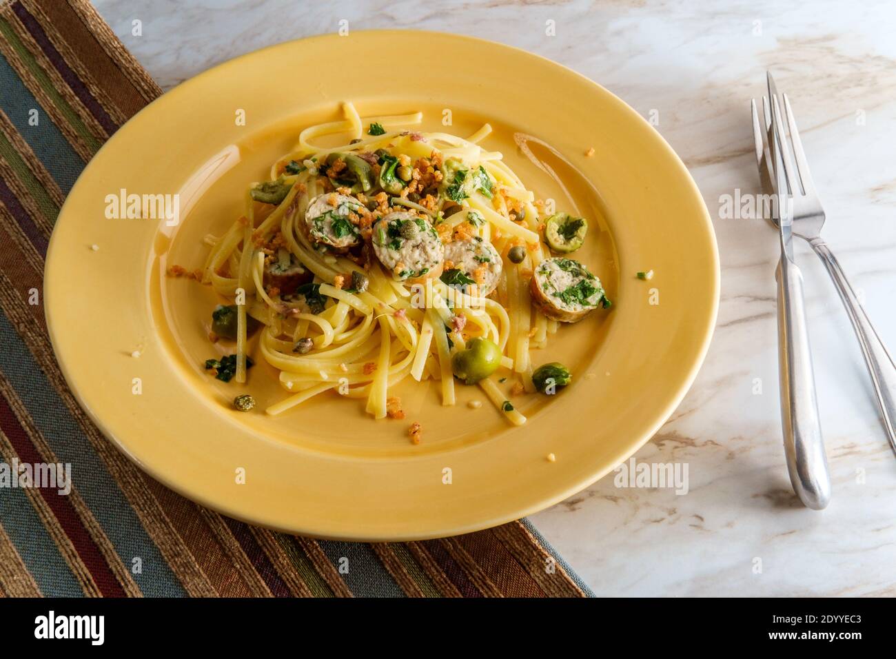 Italian chicken spinach sausage and linguine with herbed green castelvetrano olive sauce