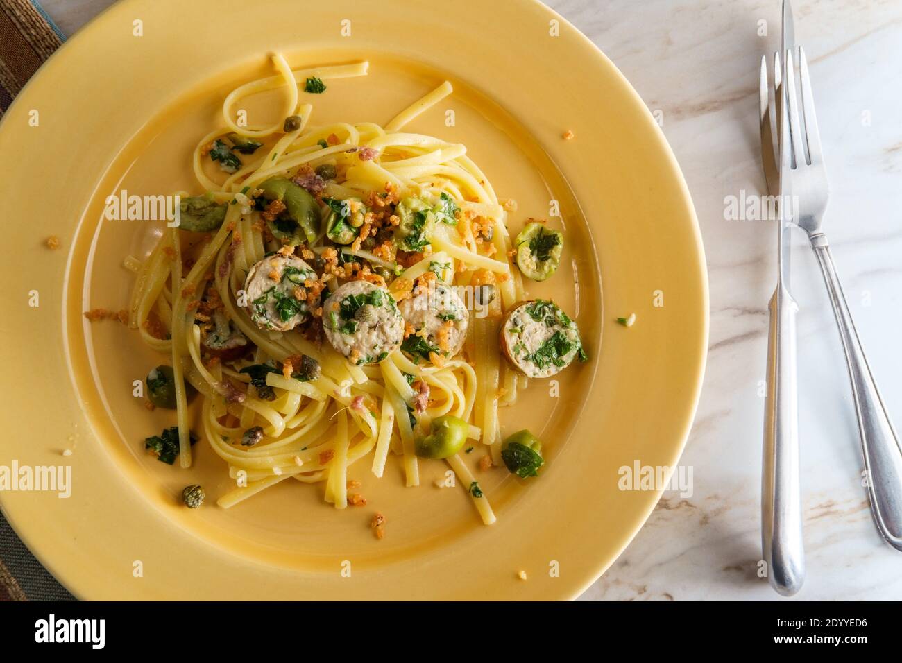 Italian chicken spinach sausage and linguine with herbed green castelvetrano olive sauce