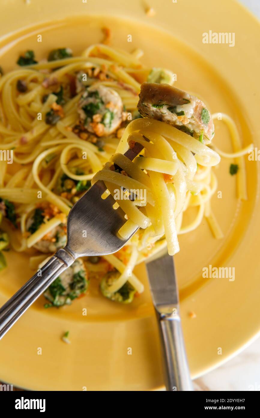 Italian chicken spinach sausage and linguine with herbed green castelvetrano olive sauce