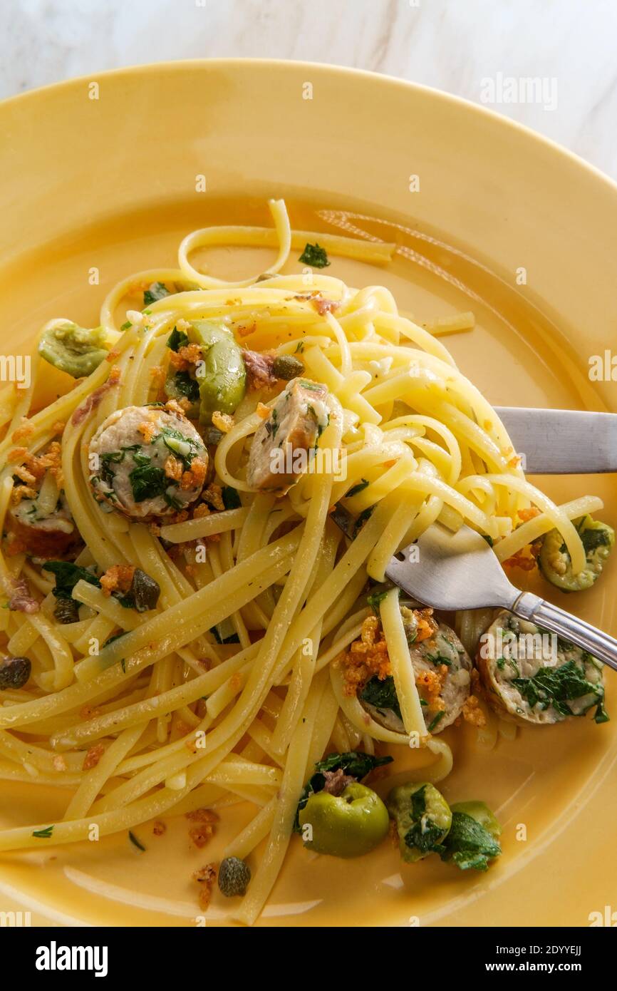 Italian chicken spinach sausage and linguine with herbed green castelvetrano olive sauce