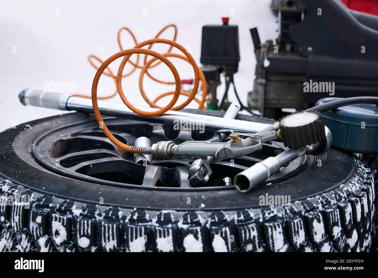 pump with pressure gauge and other equipment for changing car tires on