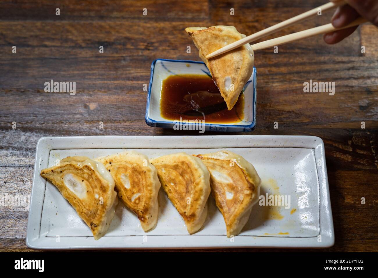 Japanese gyoza served in plate with delicious soy sauce dip Stock Photo