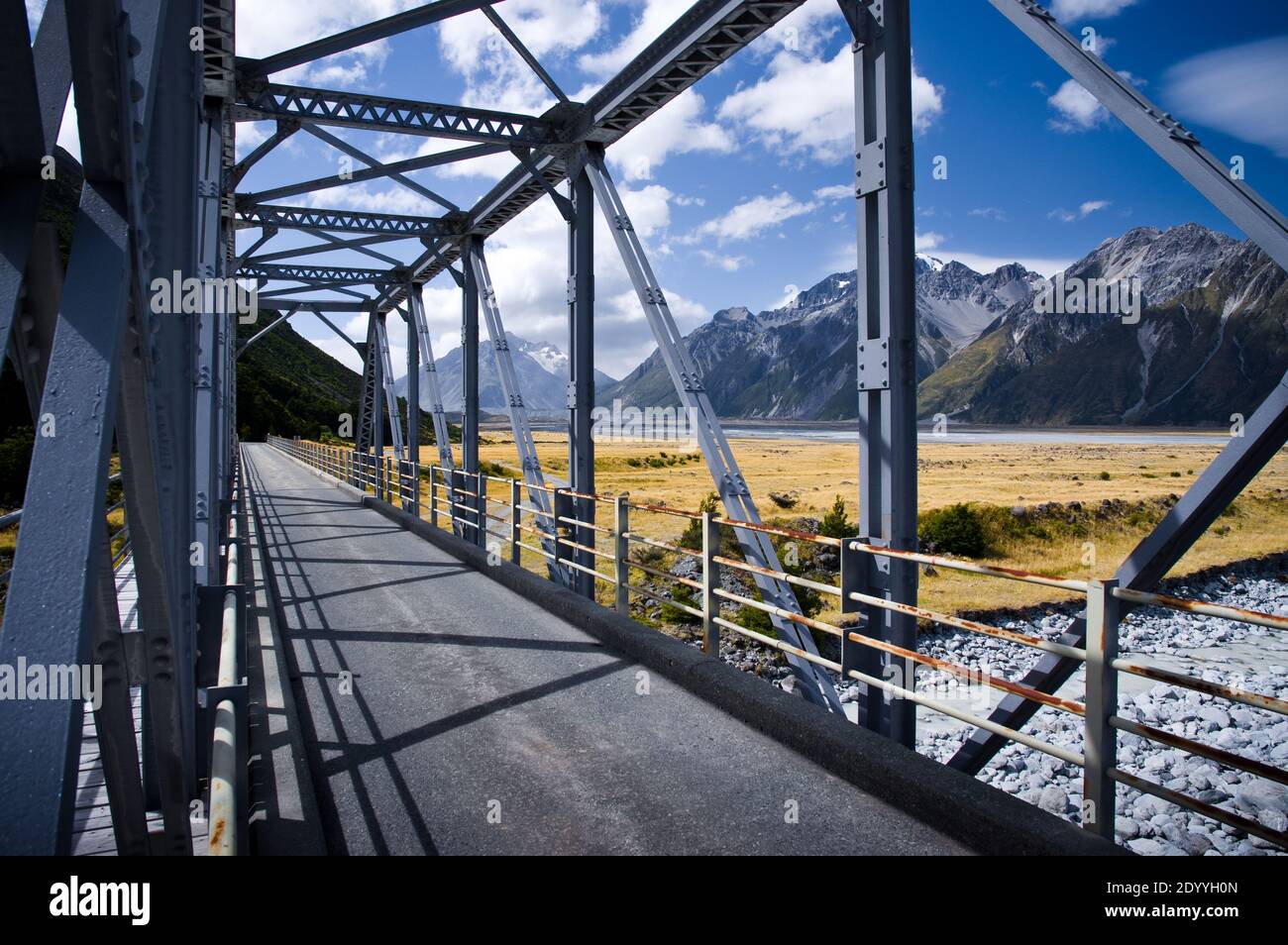 The bridge leading into the Tasman valley in Mt Count National Park, New Zealand on a summer day. Stock Photo