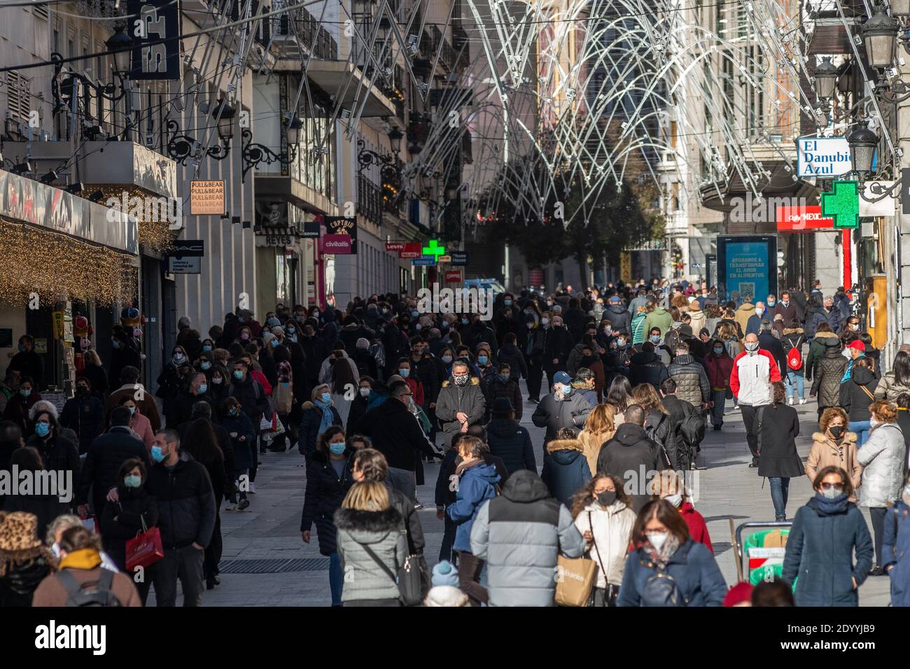Madrid, Spain. 28th Dec, 2020. People walking in the shopping area near Sol  Square. This year it is not allowed to meet people in Puerta del Sol to  take the traditional 12