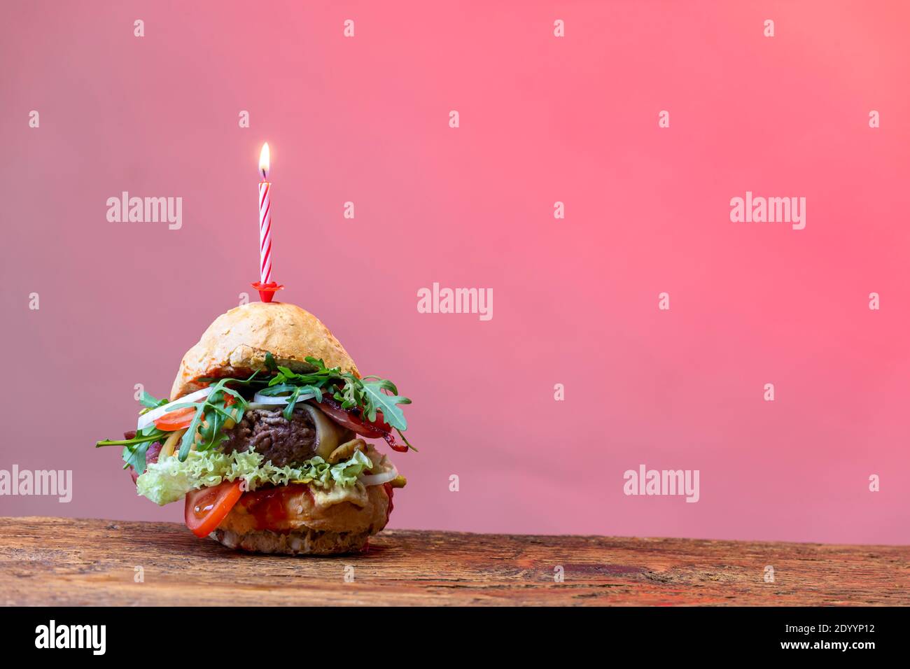 single hamburger on dark wood Stock Photo