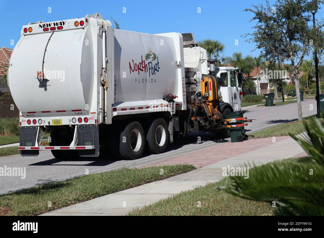 Garbage truck collecting trash Stock Photo Alamy