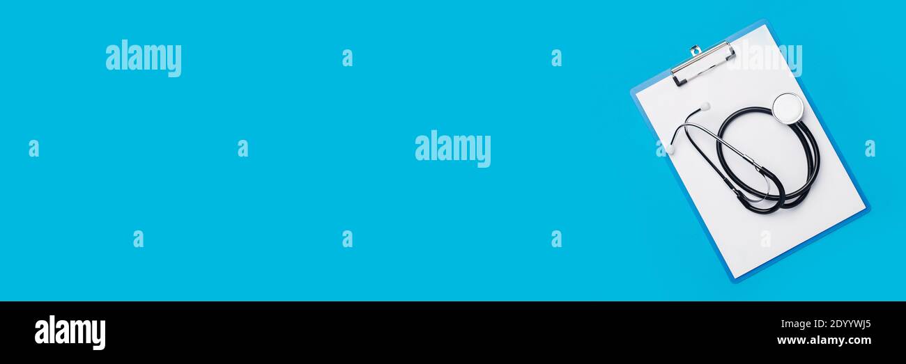 Medical stethoscope and clipboard on a blue background. Banner. Top ...