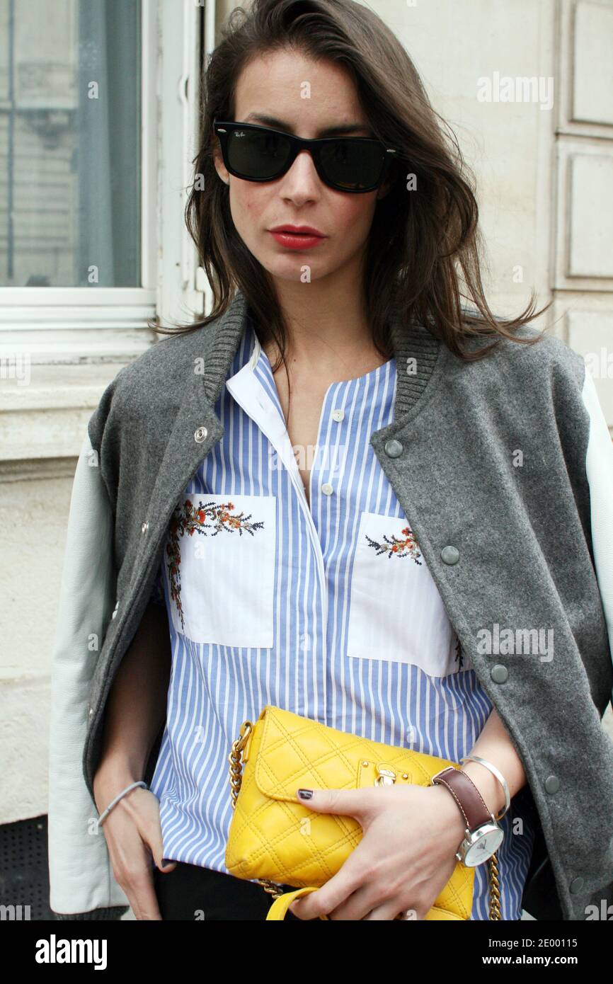 Street Style. Irina, a fashion blogger (portablepackage.com), attends Chloe Spring-Summer 2014 fashion show held at Lycee Carnot, Paris, France, on september 29 th, 2013. She's wearing an American College Jacket, a Suno shirt, By Marlene Biger pants, Yves Saint Laurent shoes,and a Marc Jacobs bag. Photo by Charlotte Moitessier/ABACAPRESS.COM Stock Photo