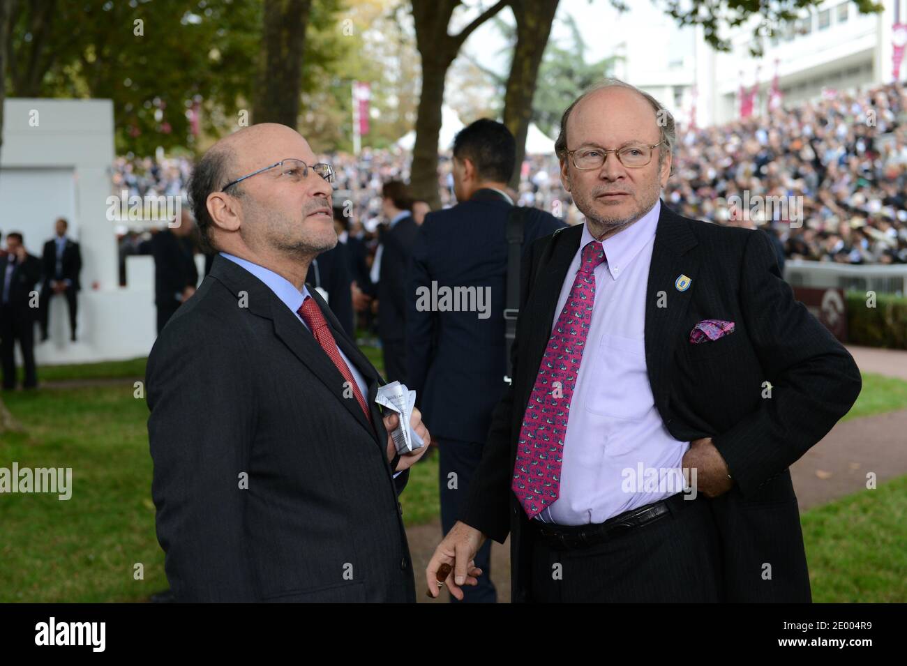 Alain (right) and Gerard Wertheimer (left), owners of Chanel fashion brand,  win one of the races with the horse 'Indonesienne' prior to Qatar Prix de  l'Arc de Triomphe held at Longchamp racecourse,