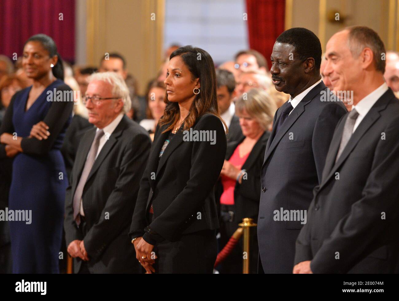 Triple Olympic Champion Marie-Jose Perec, sports journalist Jacques Vendroux, Legion of Honor and National Order of Merit insignia to 4x100m World champion Christine Arron, Former Olympique de Marseille football club's president Pape Diouf during a ceremony to award French sports personalities at the Elysee Palace in Paris, France on October 9, 2013. Photo by Christian Liewig/ABACAPRESS.COM Stock Photo