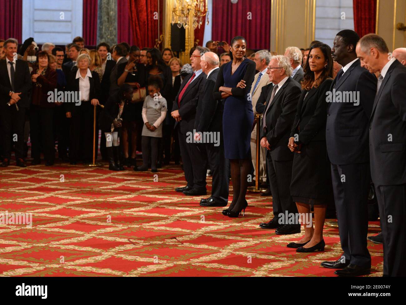 French President Francois Hollande (3rdL) poses with recipients of the  Legion of Honor and National Order of Merit insignia during a ceremony to  award French sports personalities at the Elysee Palace in