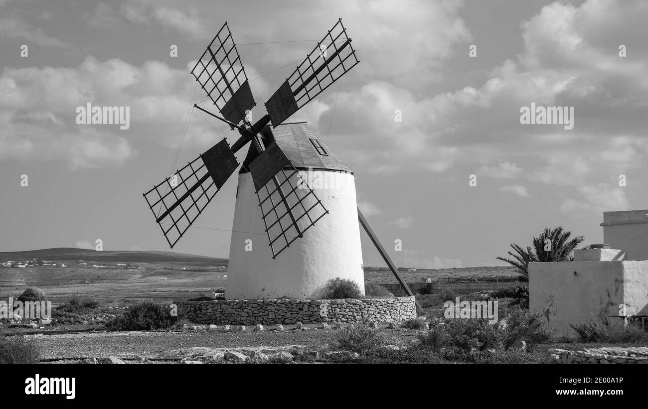 Wild landscape of Fuerteventura with white windmill, Llanos de la Concepción town. Energy of wind. Canary islands. Spain. Black and white photography. Stock Photo