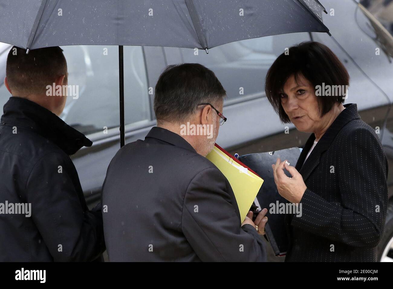 French Minister in Charge of Relations with the Parliament Alain Vidalies and Junior Minister for Disabled People Marie-Arlette Carlotti leave the Elysee presidential Palace after the weekly cabinet meeting, in Paris, France on October 16, 2013. Photo by Stephane Lemouton/ABACAPRESS.COM Stock Photo