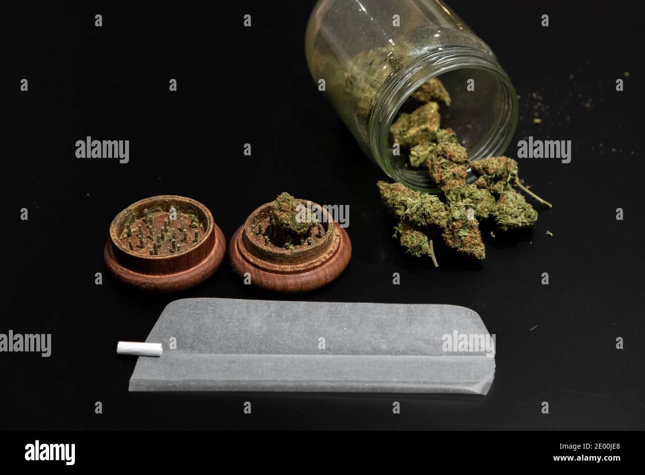 Joint, cannabis buds, grinder other smoking accessories Stock Photo