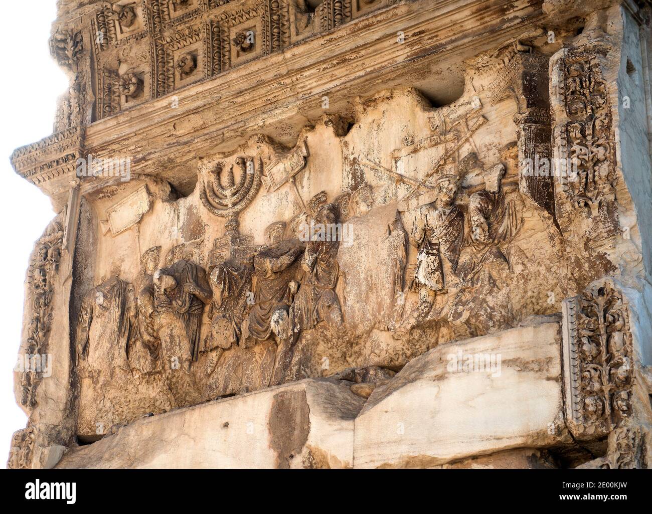 Detail of the fresco showing the Golden Menorah in the Arch of Titus, located on the Via Sacra, just to the south-east of the Roman Forum in Rome, Italy, which was built to commemorate Titus's victory in Judea, depicts a Roman victory procession with soldiers carrying spoils from the Temple, including the Menorah, which were used to fund the construction of the Colosseum, on Wednesday, October 23, 2013. It was constructed c. 82 AD by the Roman Emperor Domitian shortly after the death of his older brother Titus to commemorate Titus' victories, including the Siege of Jerusalem in 70 AD. The Arch Stock Photo