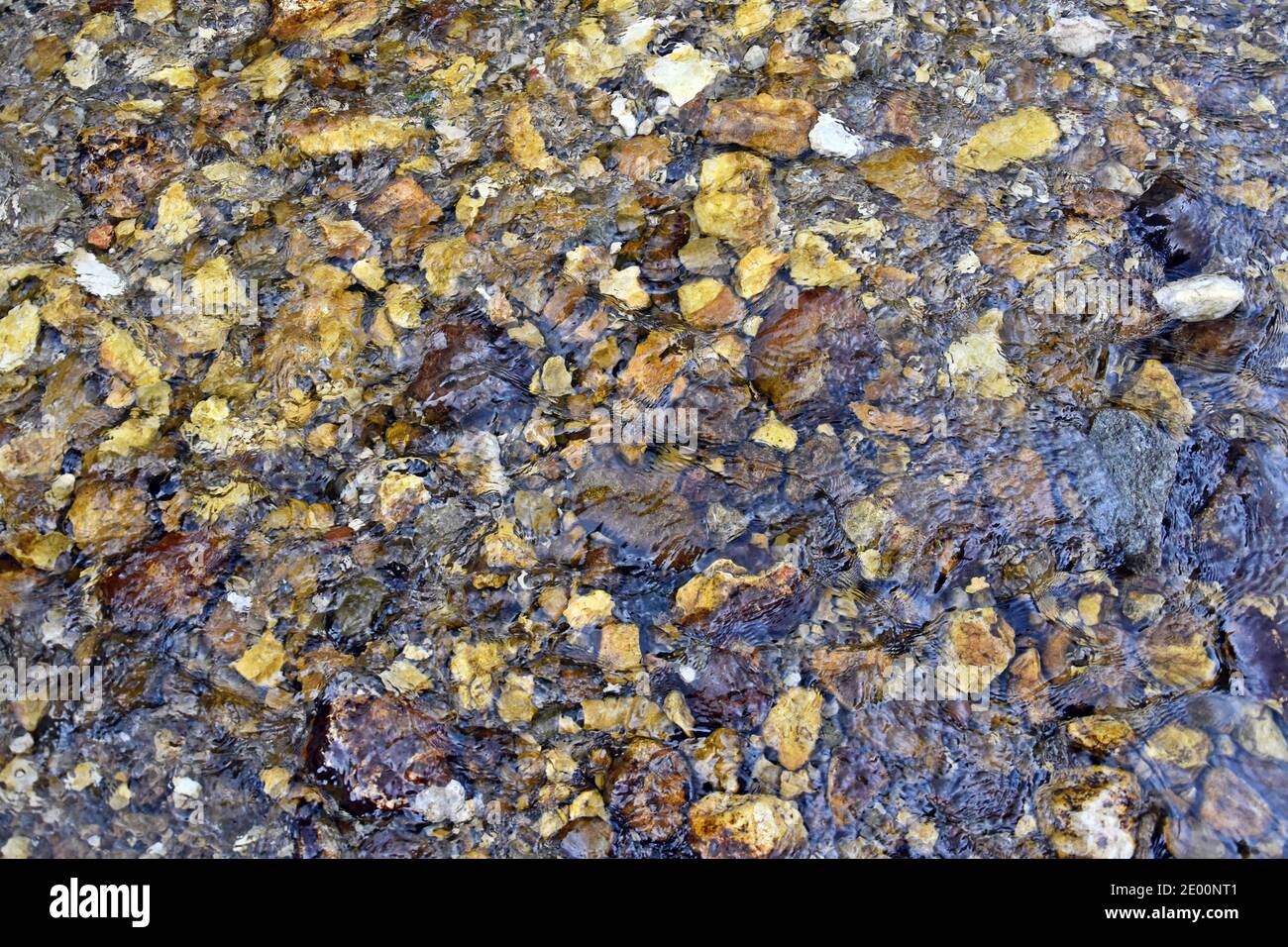 Background with flowing water (stream) and rocks. Stock Photo