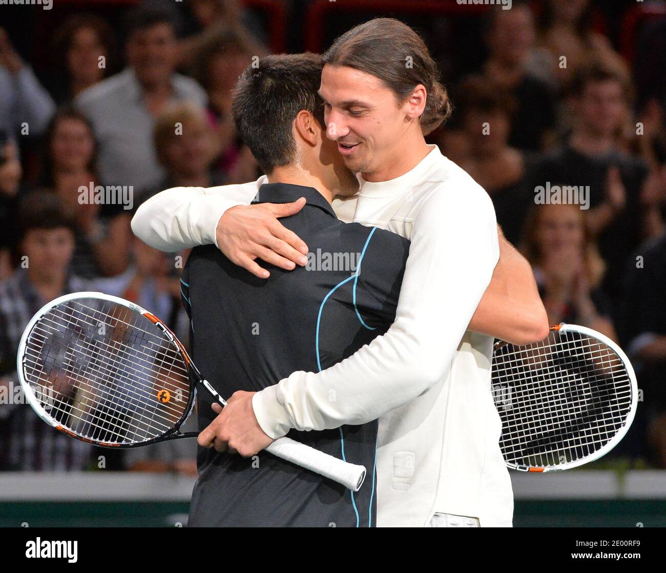 Footballer Zlatan Ibrahimovic with Novak Djokovic of Serbia after a quick  game after the match against Roger Federer of Switzerland during the BNP  Paribas Masters Series Tennis Open 2013 at Palais Omnisports