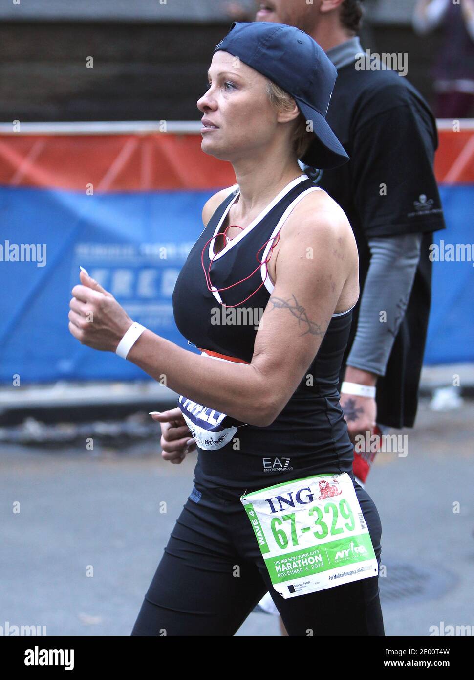 US actress Pamela Anderson is running with her brother Gerry The 2013