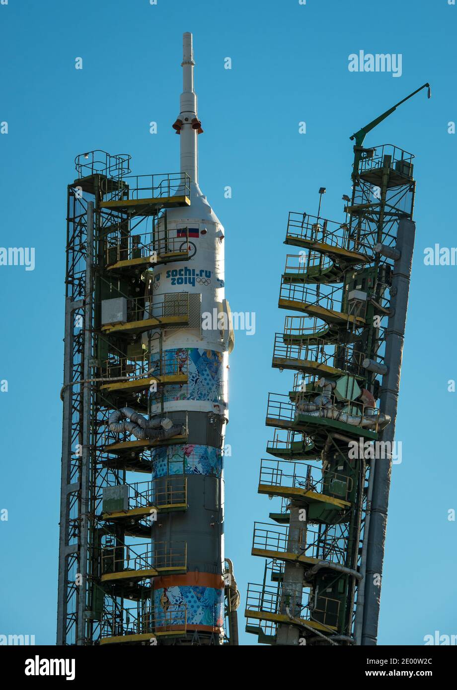 The Soyuz TMA-11M rocket, adorned with the logo of the Sochi Olympic Organizing Committee and other related artwork, as the service structure arms are raised into position at the launch pad on Tuesday, on November 5, 2013, at the Baikonur Cosmodrome in Kazakhstan. Launch of the Soyuz rocket is scheduled for November 7 and will send Expedition 38 Soyuz Commander Mikhail Tyurin of Roscosmos, Flight Engineer Rick Mastracchio of NASA and Flight Engineer Koichi Wakata of the Japan Aerospace Exploration Agency on a six-month mission aboard the International Space Station. Handout Photo by Bill Ingal Stock Photo