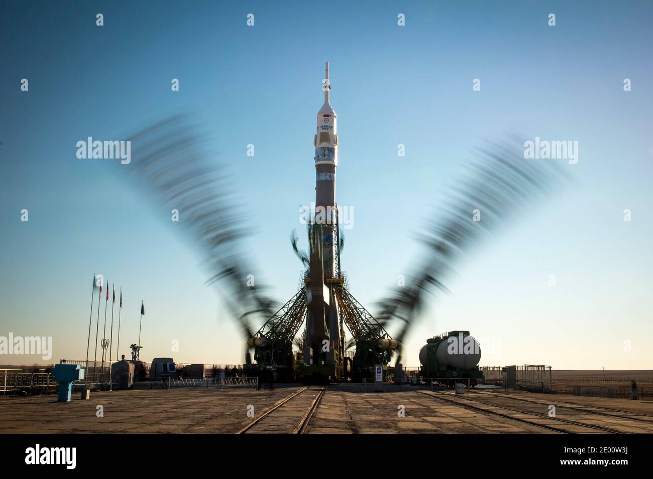 The Soyuz TMA-11M rocket, adorned with the logo of the Sochi Olympic Organizing Committee and other related artwork, is seen in this long exposure photograph, as the service structure arms are raised into position at the launch pad on Tuesday, on November 5, 2013, Baikonur Cosmodrome in Kazakhstan. Launch of the Soyuz rocket is scheduled for November 7 and will send Expedition 38 Soyuz Commander Mikhail Tyurin of Roscosmos, Flight Engineer Rick Mastracchio of NASA and Flight Engineer Koichi Wakata of the Japan Aerospace Exploration Agency on a six-month mission aboard the International Space S Stock Photo