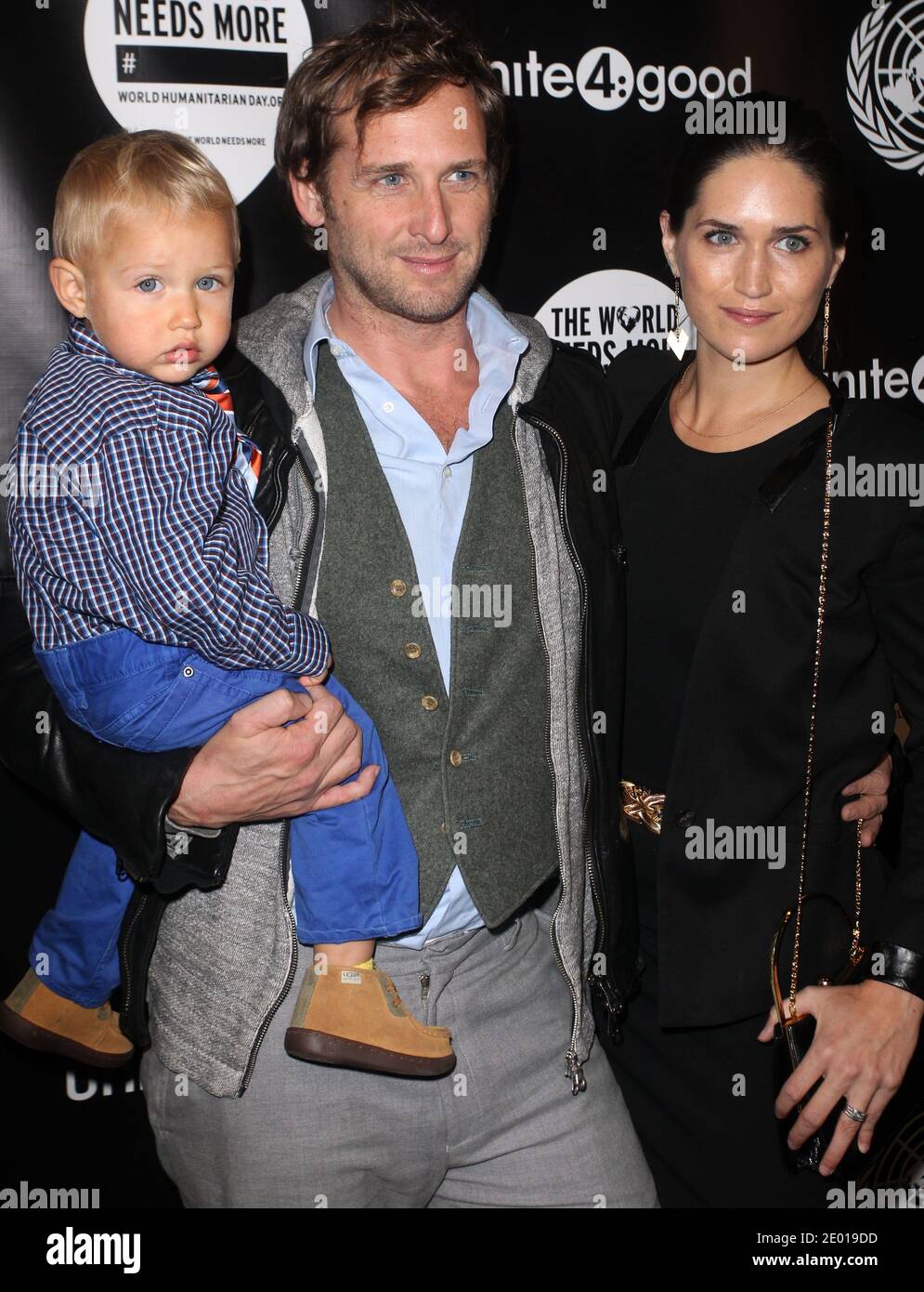 Actor Josh Lucas with his wife Jessica Henriquez and their son Noah attend the premiere of David Guetta's new music video 'One Voice' onto the front of United Nations headquarters in New York City, NY, USA, on November 22, 2013. Photo by Charles Guerin/ABACAPRESS.COM. Stock Photo