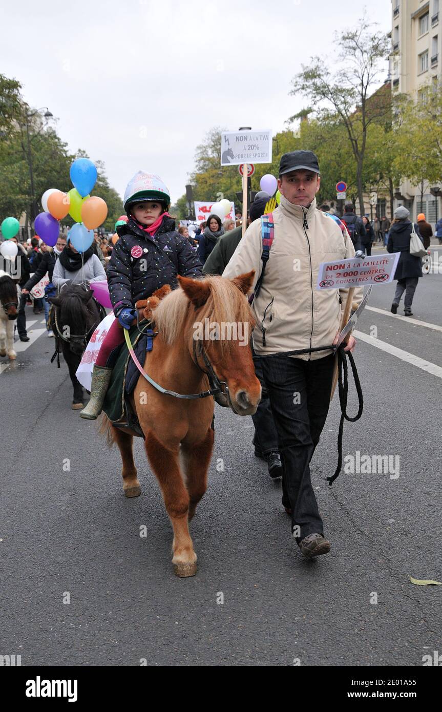 Horse riding workers and users demonstrate in the streets of Paris to protest against a VAT rising for equestrian centers. From January 1st, 2014, equestrian centers will no longer benefit the reduced VAT rate of 7% but the highest rate of 20%., France, November 24, 2013. Photo by Thierry Plessis/ABACAPRESS.COM Stock Photo