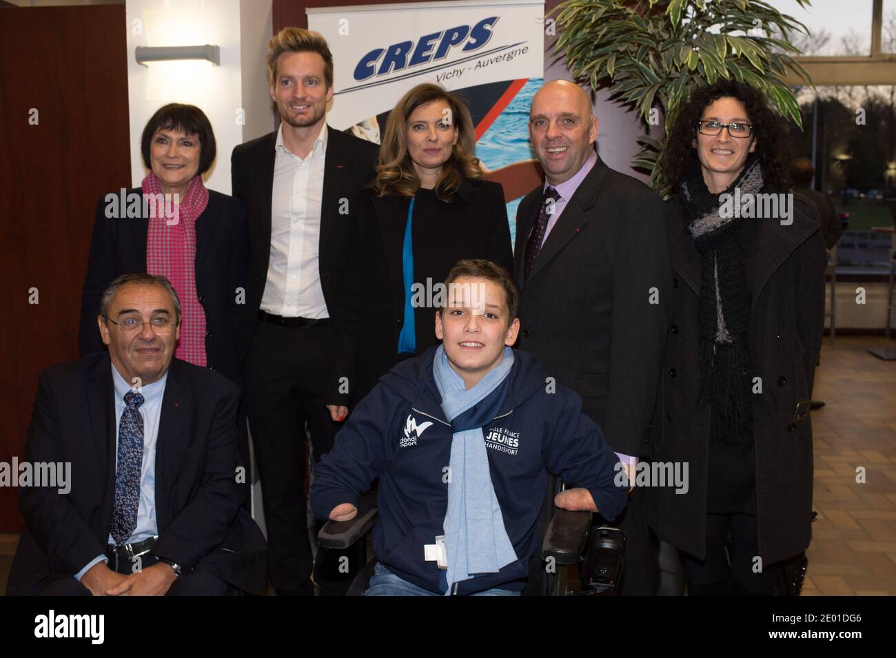 Companion of France's President Valerie Trierweiler and Marie-Arlette Carlotti pose with Theo, a 13-year-old 4-limb amputee, as part of her visit on November 27, 2013 in Vichy, central France. Theo is a grant holder of the disabled sports branch of the French Expertise and Performance Ressource Centre (CREPS) of Vichy Auvergne, where he trains in swimming. In early 2013, he competed for the first time in the French disabled swimming championships. Photo by Christophe Guibbaud/ABACAPRESS.COM Stock Photo