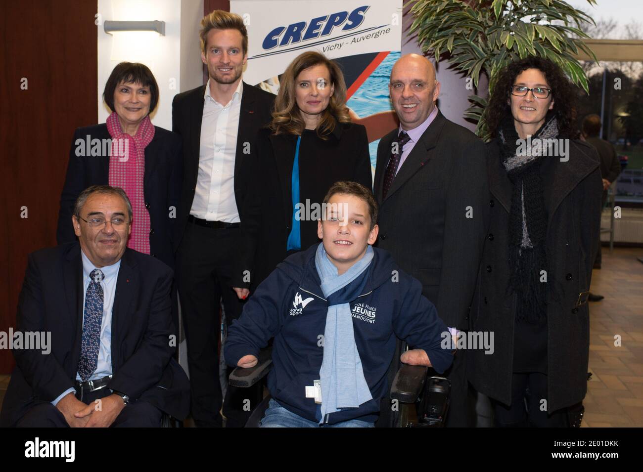 Companion of France's President Valerie Trierweiler and Marie-Arlette Carlotti pose with Theo, a 13-year-old 4-limb amputee, as part of her visit on November 27, 2013 in Vichy, central France. Theo is a grant holder of the disabled sports branch of the French Expertise and Performance Ressource Centre (CREPS) of Vichy Auvergne, where he trains in swimming. In early 2013, he competed for the first time in the French disabled swimming championships. Photo by Christophe Guibbaud/ABACAPRESS.COM Stock Photo