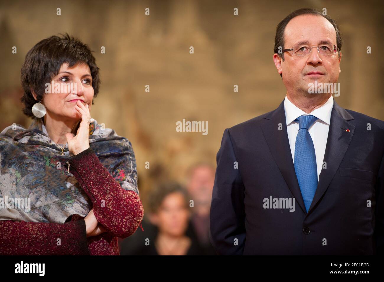 French President Francois Hollande delivers his speech watched by Junior Minister for the Disabled Marie-Arlette Carlotti during the annual awarding ceremony of La Medaille de la Famille Francaise (Medal of the French Family), at the Elysee Palace in Paris, France on November 30, 2013. The award is to honour those who have successfully raised several children with dignity. Photo by Nicolas Gouhier/ABACAPRESS.COM Stock Photo