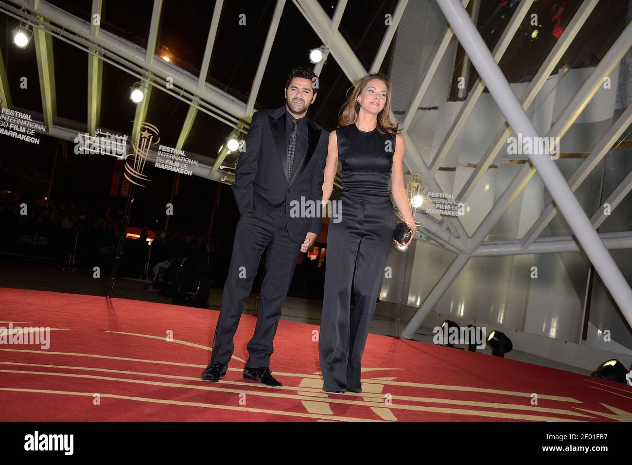 Jamel Debbouze and his wife Melissa Theuriau attending the screening of 'Like Father, Like Son' as part of the 13th Marrakech Film Festival, in Marrakech, Morocco on December 1, 2013. Photo by Nicolas Briquet/ABACAPRESS.COM Stock Photo