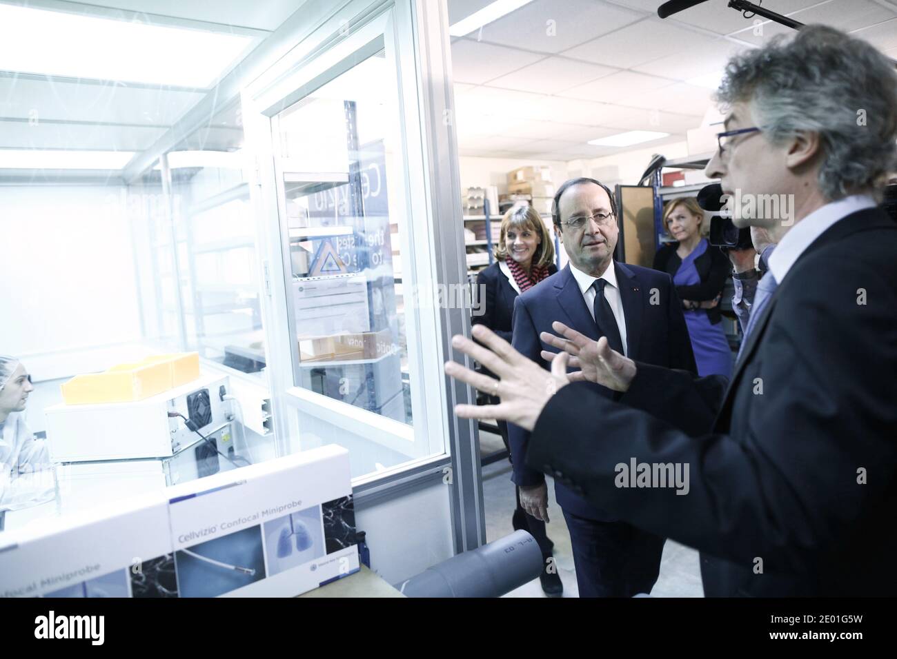 President Francois Hollande and Technology presidential adviser Anne Lauvergeon attend the presentation of Cellvizio, a Medical Endomicroscopy virtual assistant at Mauna Kea Technologies office in Paris, France, on December 2, 2013. Mauna Kea Technologies is leveraging a very strong experience in astronomical instrumentation for the development of powerful medical devices, that can provide real time microscopic imaging in the living body. Photo by Denis Allard/Pool/ABACAPRESS.COM Stock Photo