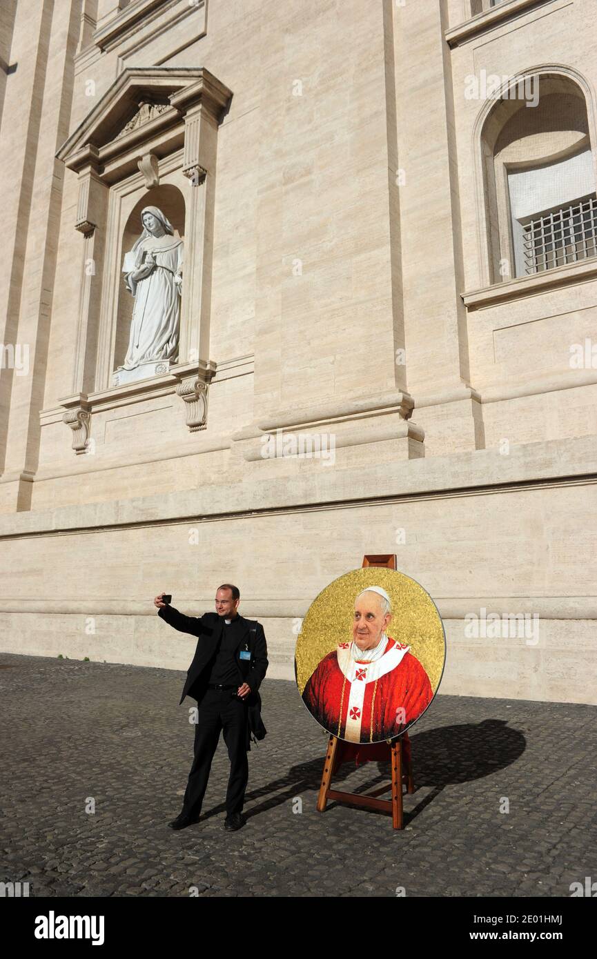 Pope Francis attends the weekly general audience on Saint Peter's square at the Vatican on December 4, 2013. Presentation of the portrait of Pope Francis. This portrait is set to join his brethren on the wall of Rome's Saint Paul basilica. Each of the popes dating back to Saint Peter is awarded a circular mosaic portrait around the internal walls of the basilica. Photo by Eric Vandeville/ABACAPRESS.COM Stock Photo