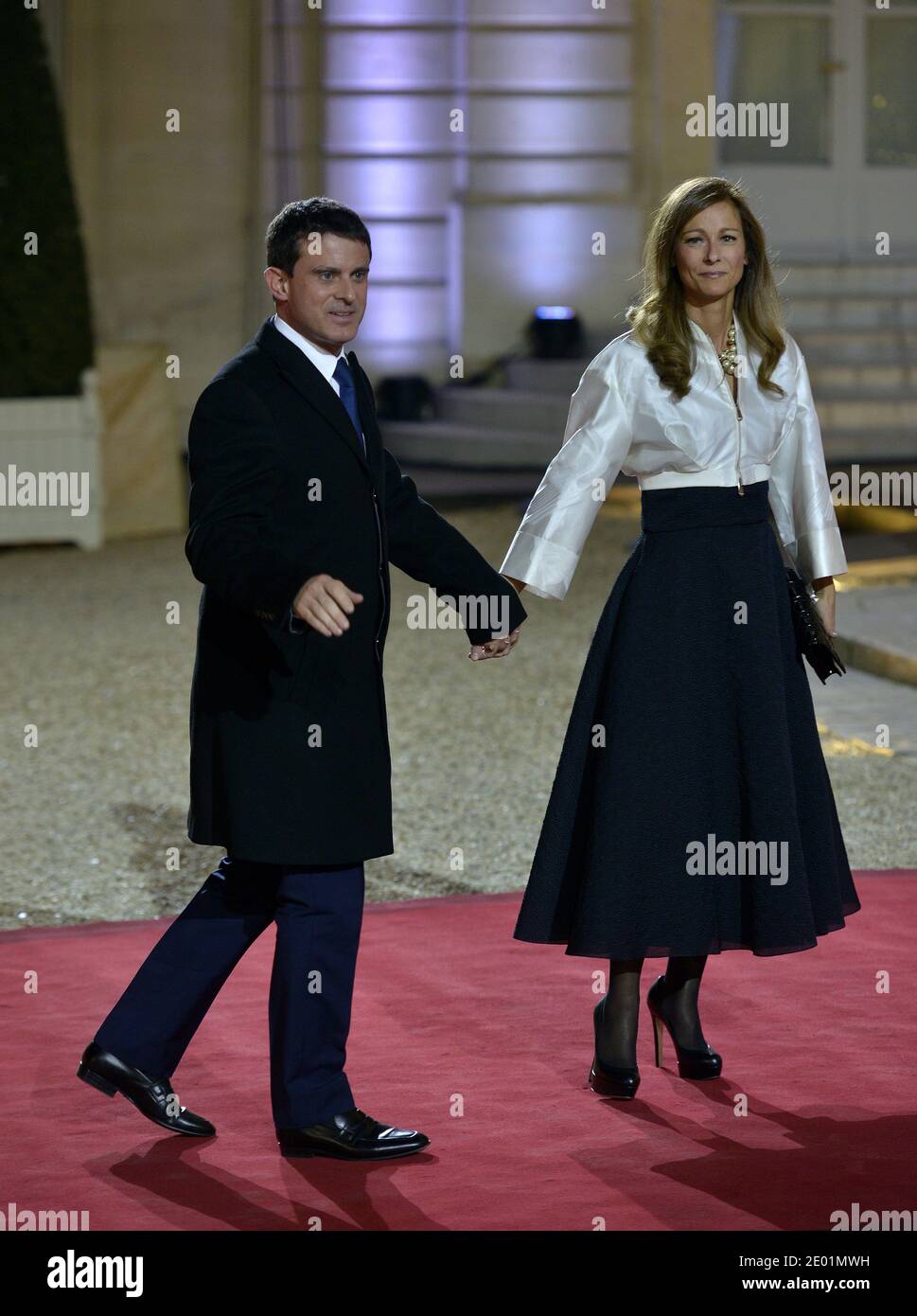 French Interior Minister Manuel Valls and his wife Anne Gravoin arrive for a dinner with the French President as part of the Summit for Peace and Security in Africa at the Elysee Palace in Paris, France on December 6, 2013. Photo by Mousse/ABACAPRESS.COM Stock Photo